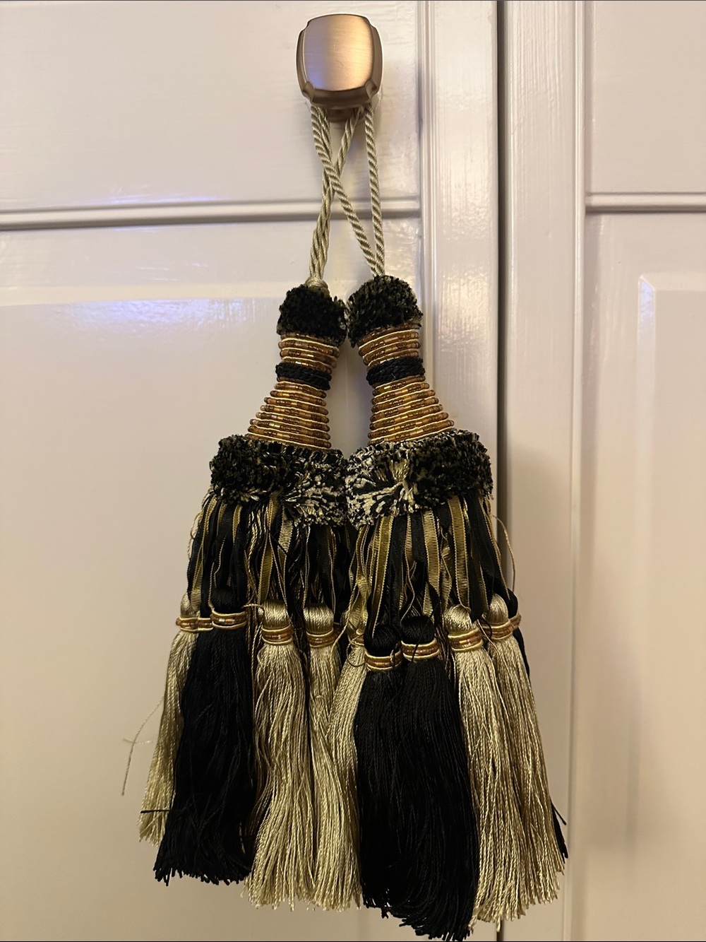 Decorative Black and Gold Tassels Accent